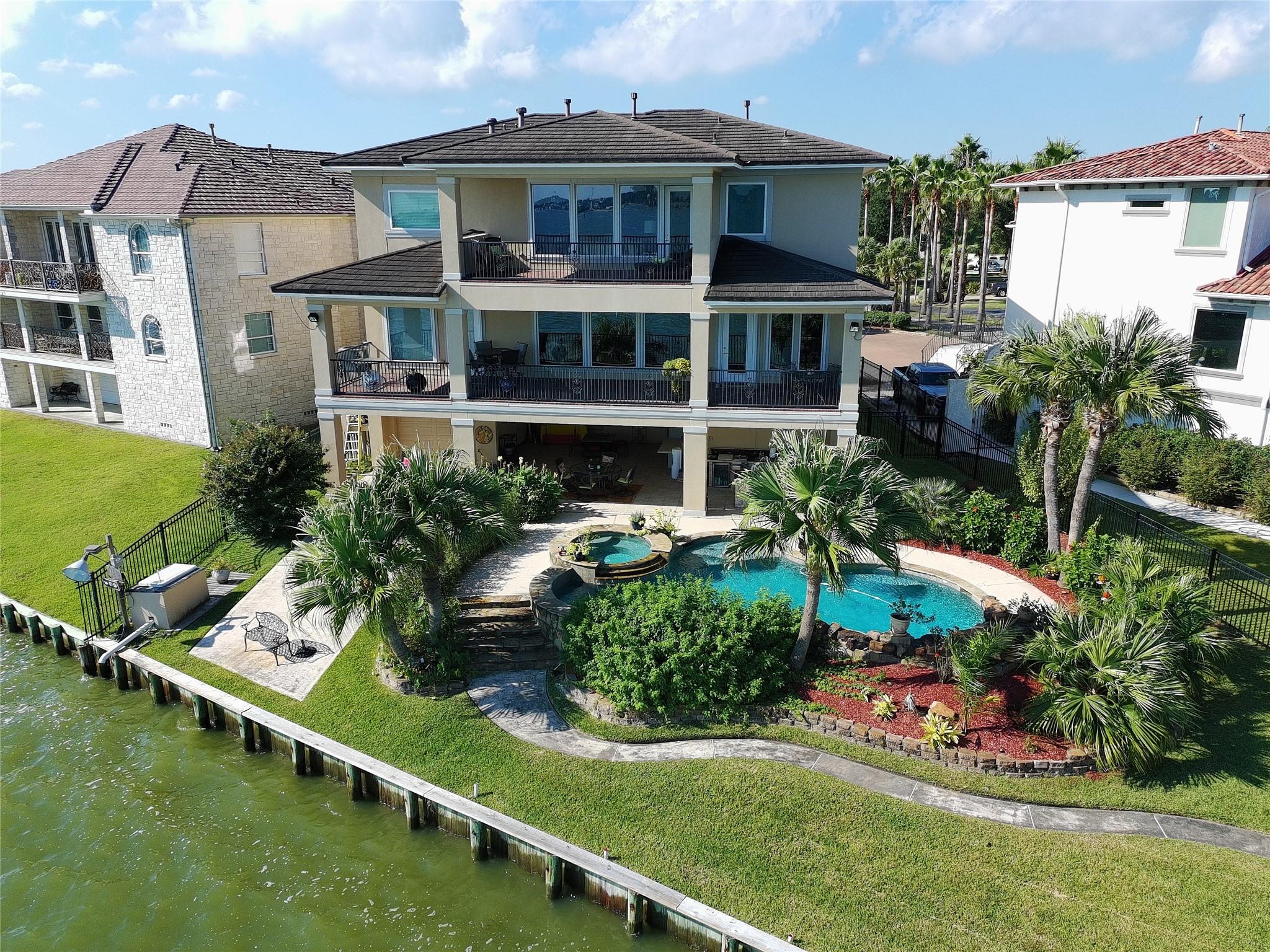 Image 2: Rear elevation of the home from the air.