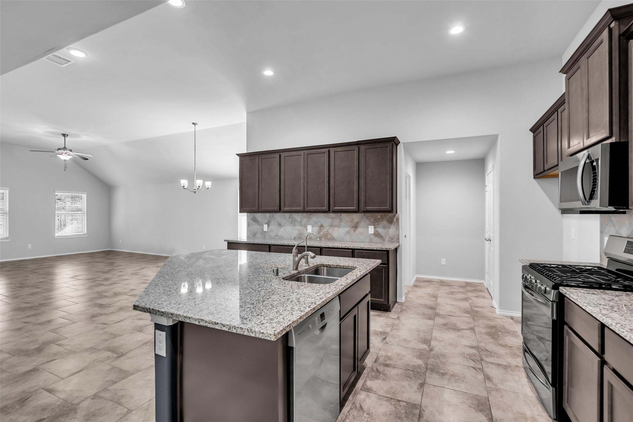 Image 3: The open concept living space is perfect for the f