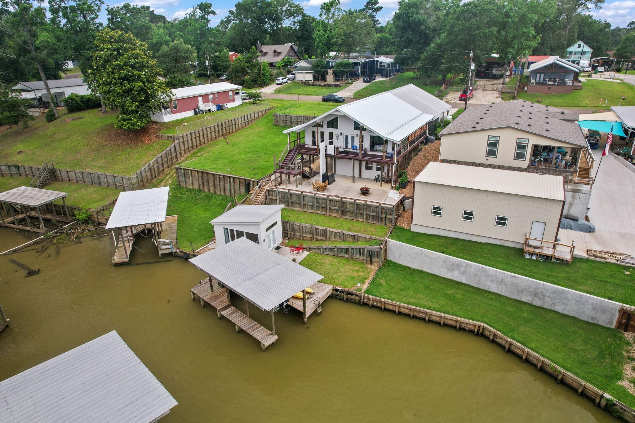 Image 1: Water, boat house, Casita with patio and lawn, gra