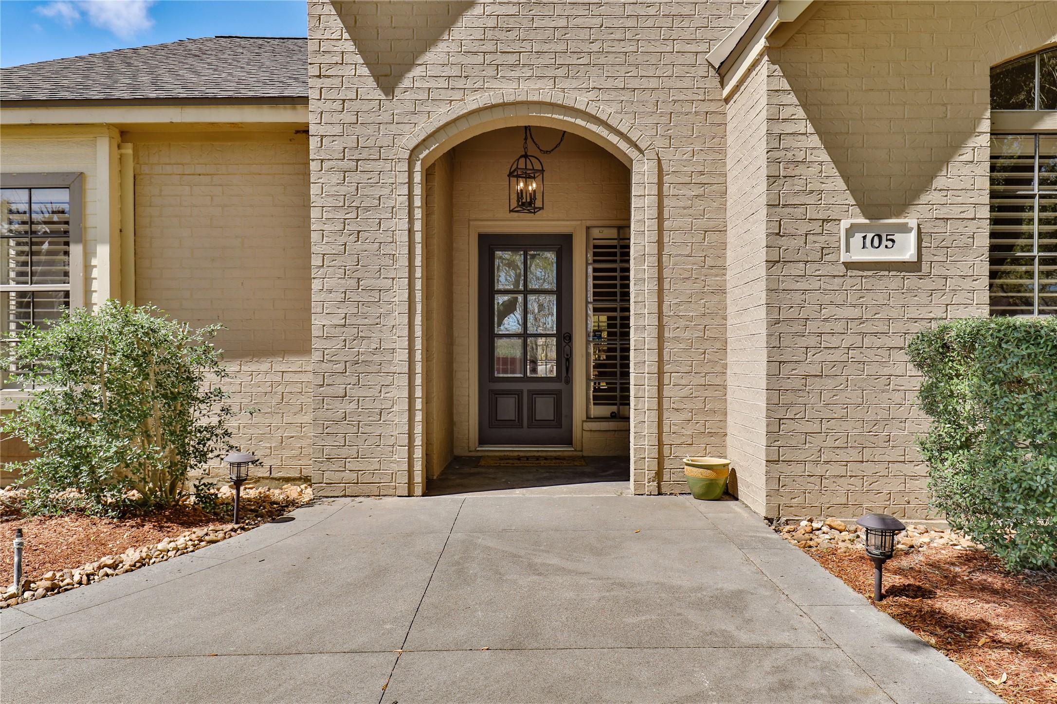Image 4: BEAUTIFUL AND WELCOMING COVERED FRONT ENTRY PORCH