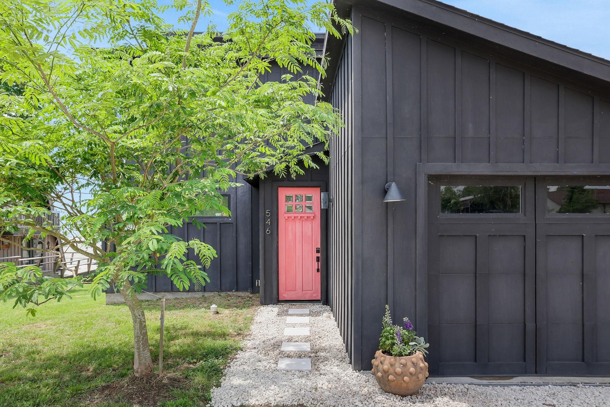 Image 4: The attached garage provides room for storage or p