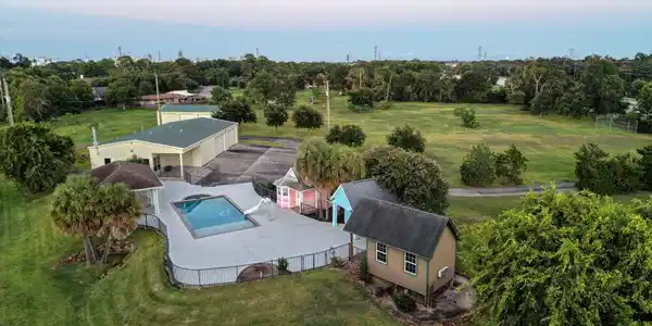 Image 3: Aerial view at sunset of this expansive private pr