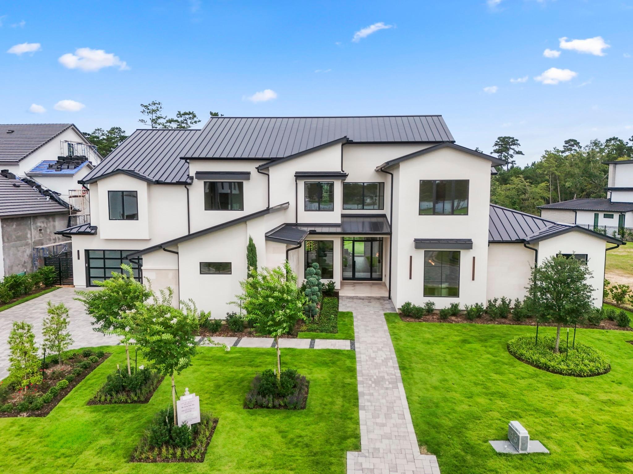 Image 2: A daytime view showcases this home's stunning elev