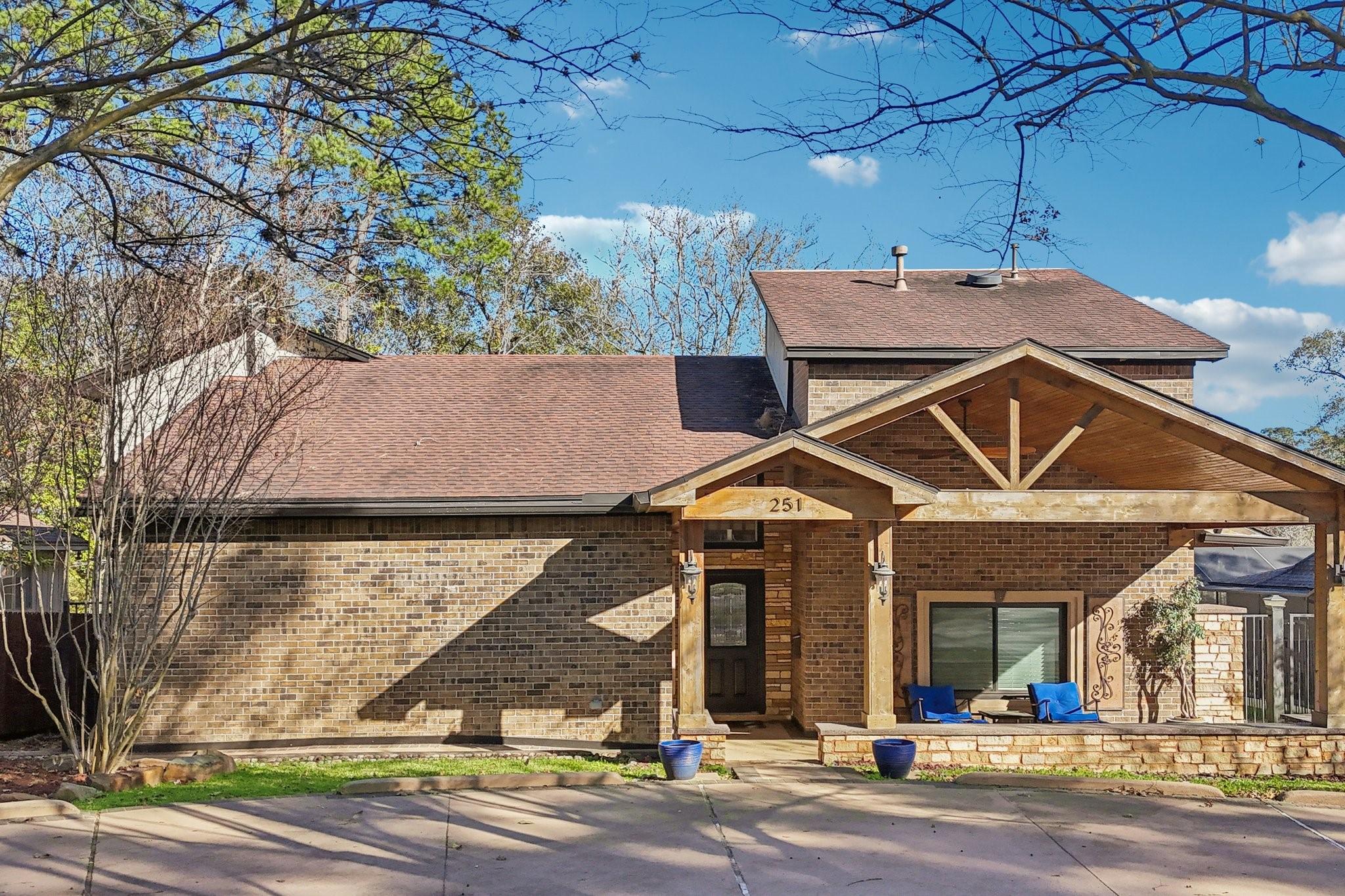 Image 2: Charming single-story brick home with a welcoming