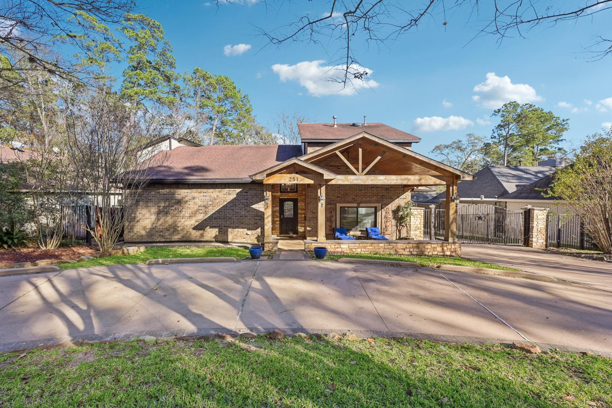 Image 3: Charming single-story home with a striking brick f
