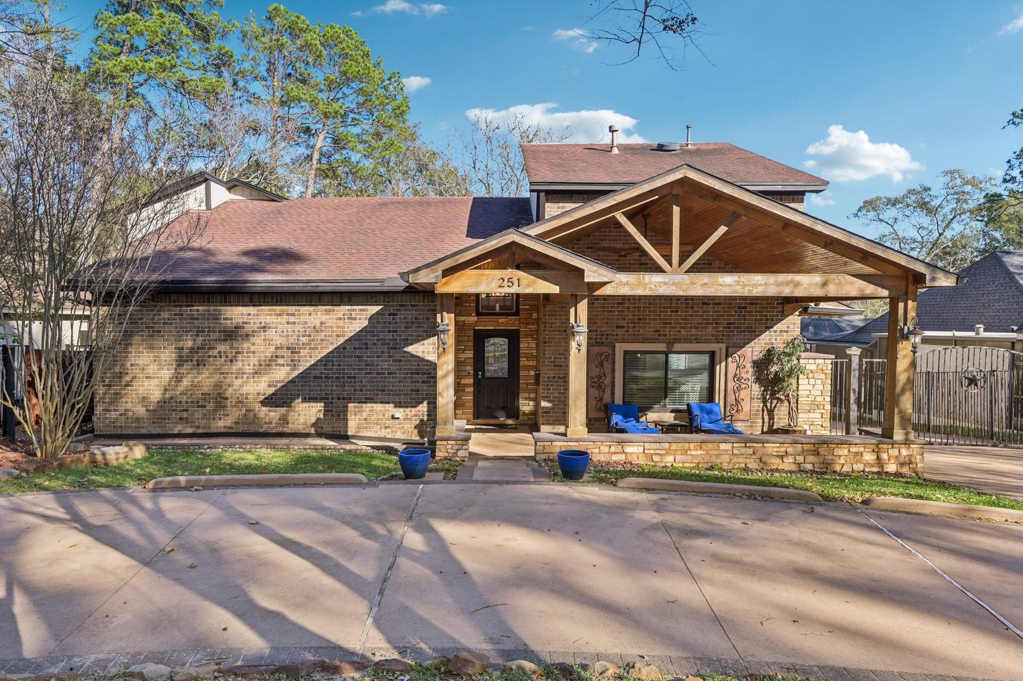 Image 4: Charming brick home with a welcoming covered porch