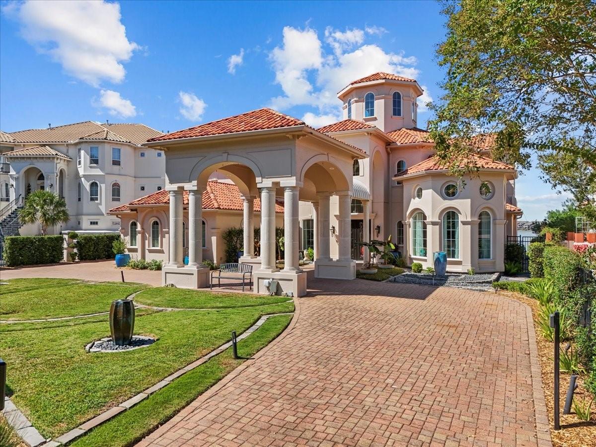 Image 1: Stunning entrance with elegant columns and a welco