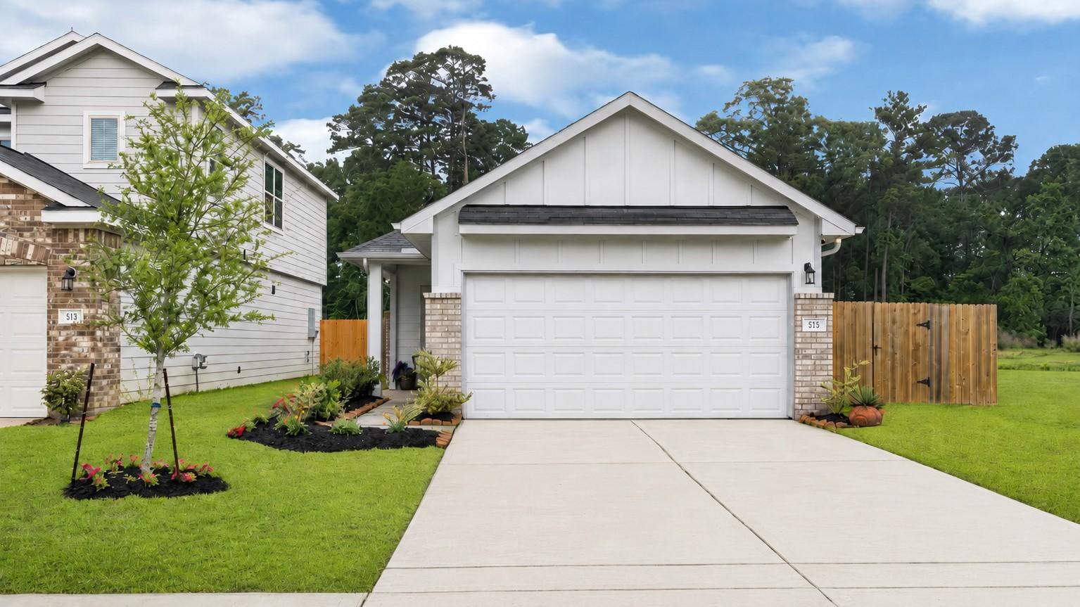 Image 2: This charming home boasts a modern exterior with A