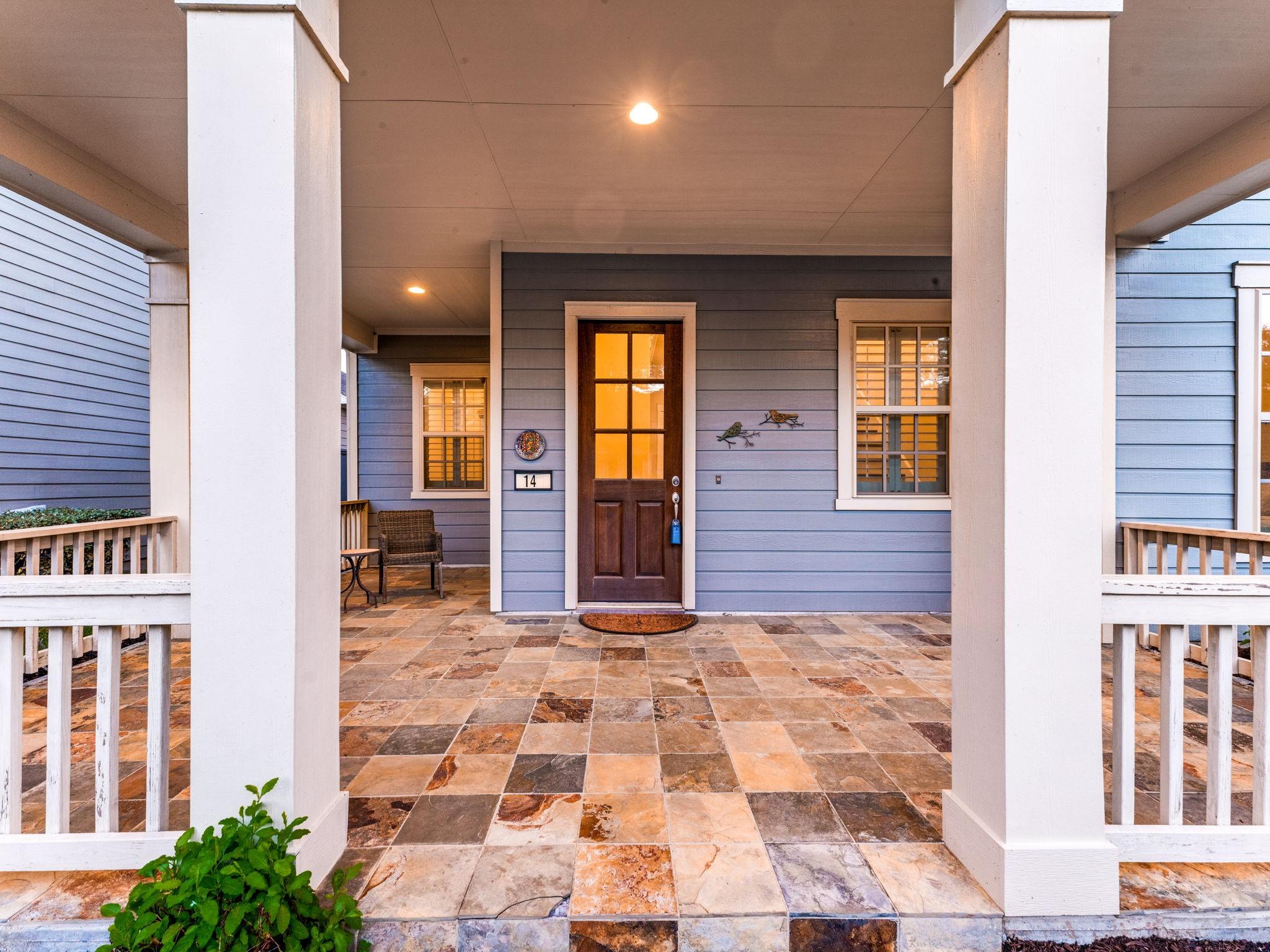 Image 4: Charming covered front porch with rich slate tile