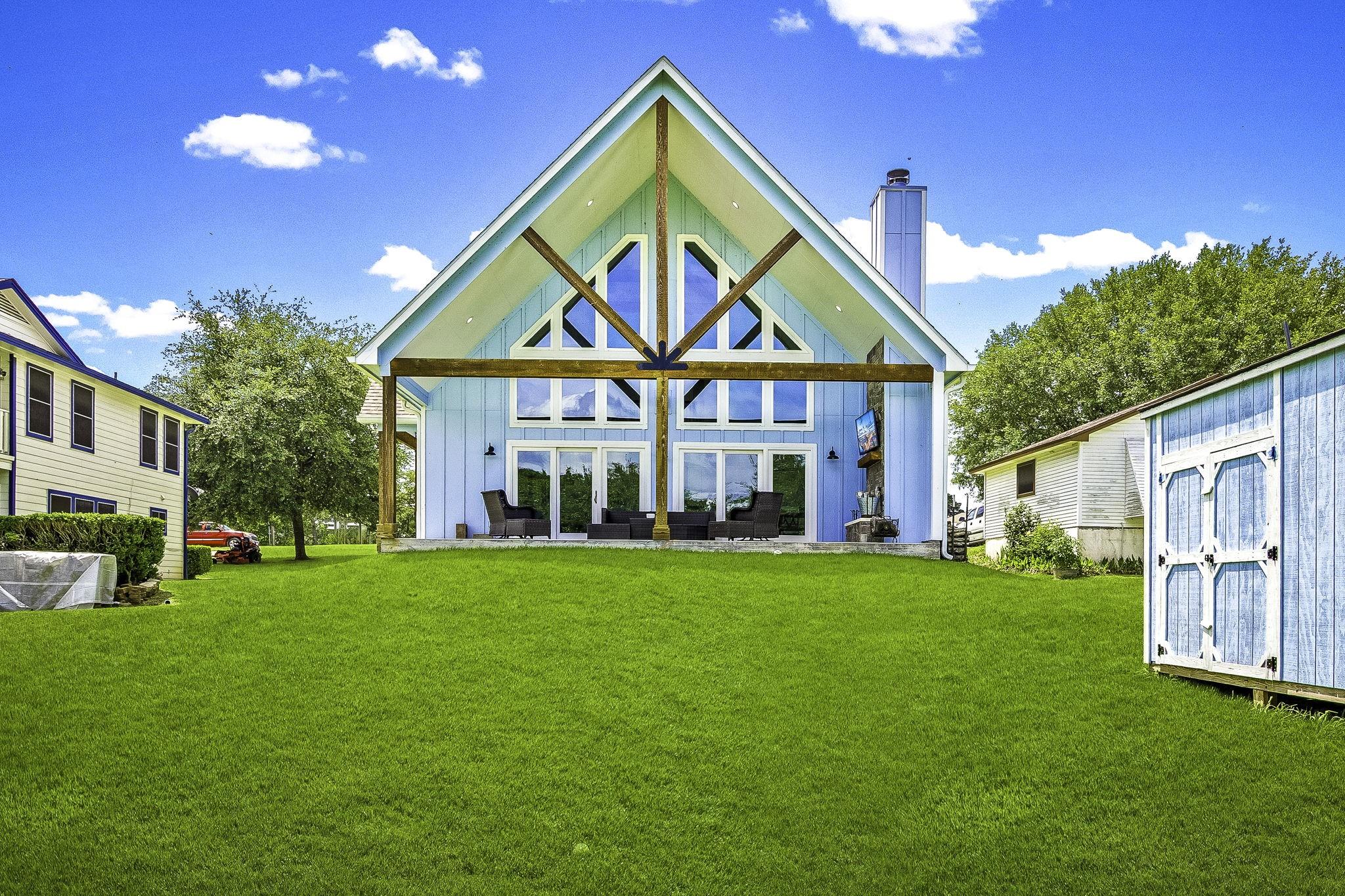 Image 4: This back porch was built for entertaining!