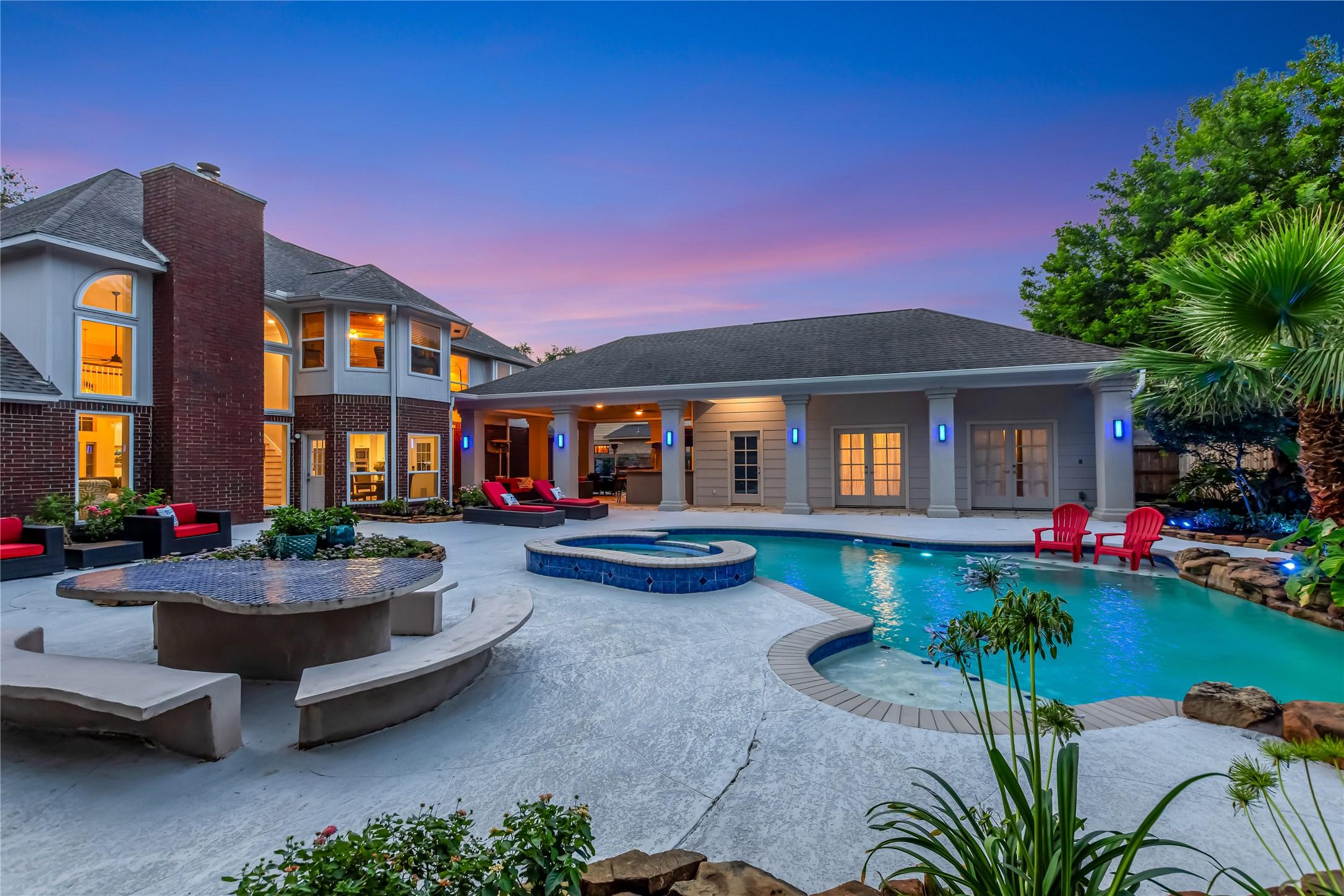 Image 2: Truly a resort styled outdoor living space .  Impe