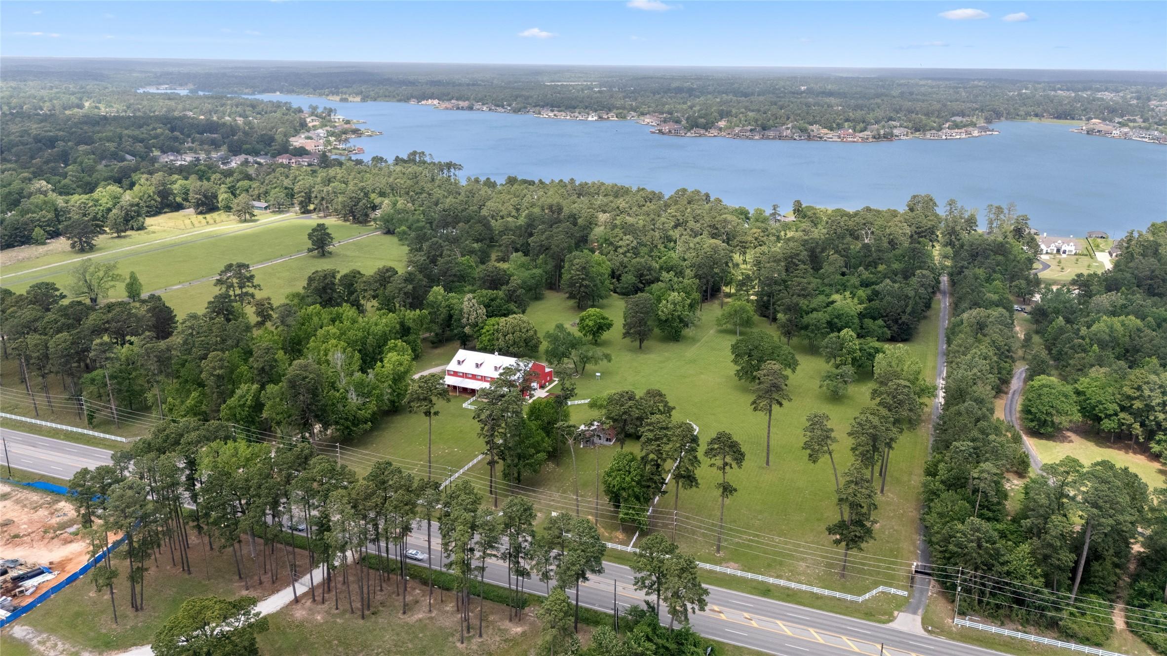 Image 2: This aerial photo shows the spacious property and