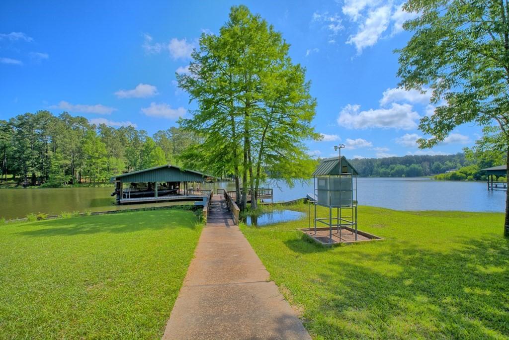 Image 4: Very gentle, paved slope to the water.