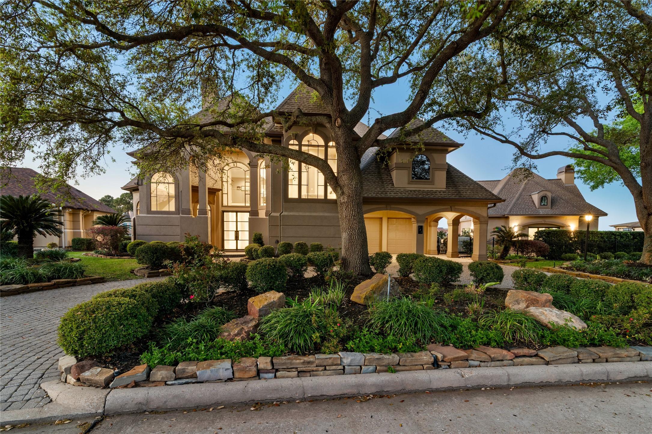 Image 2: The thoughtful landscape design sets the tone for