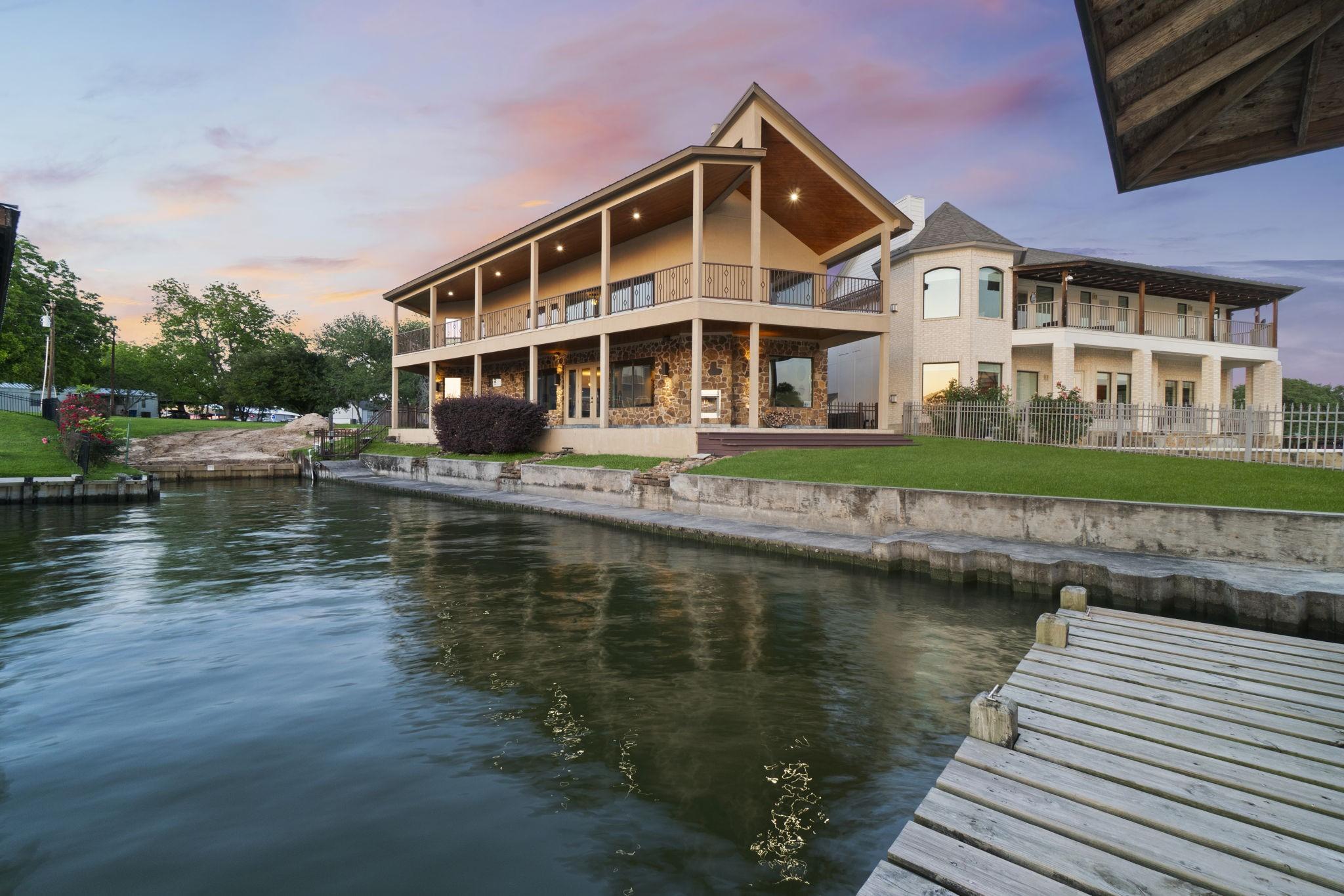 Image 1: The Lake side of the house with Bulkhead and showi