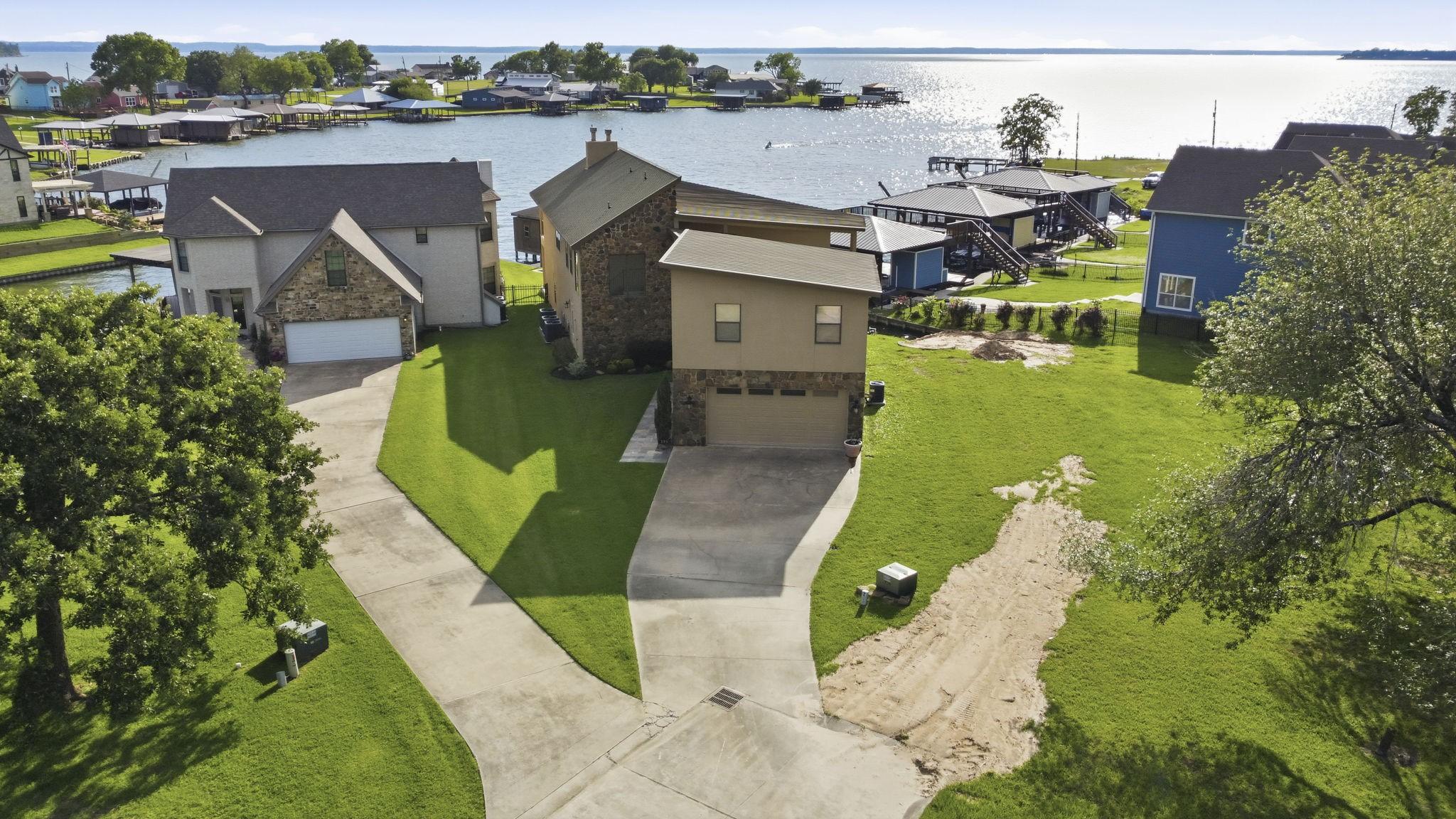 Image 3: Bird's eye view of a shimmering Lake Livingston in