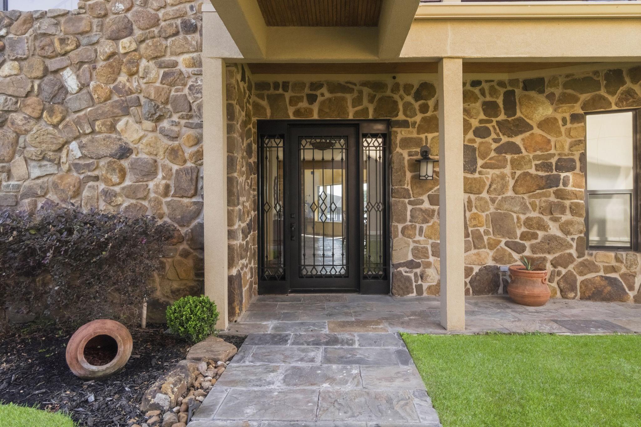 Image 4: Approaching the steel front door of the house whic