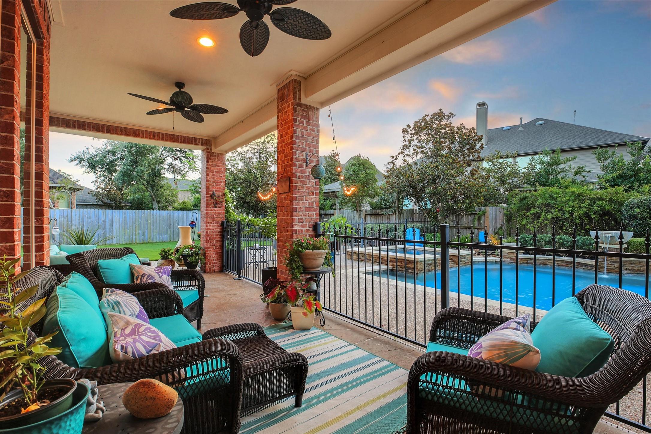 Image 4: Expansive patio with dual ceiling fans and a charm