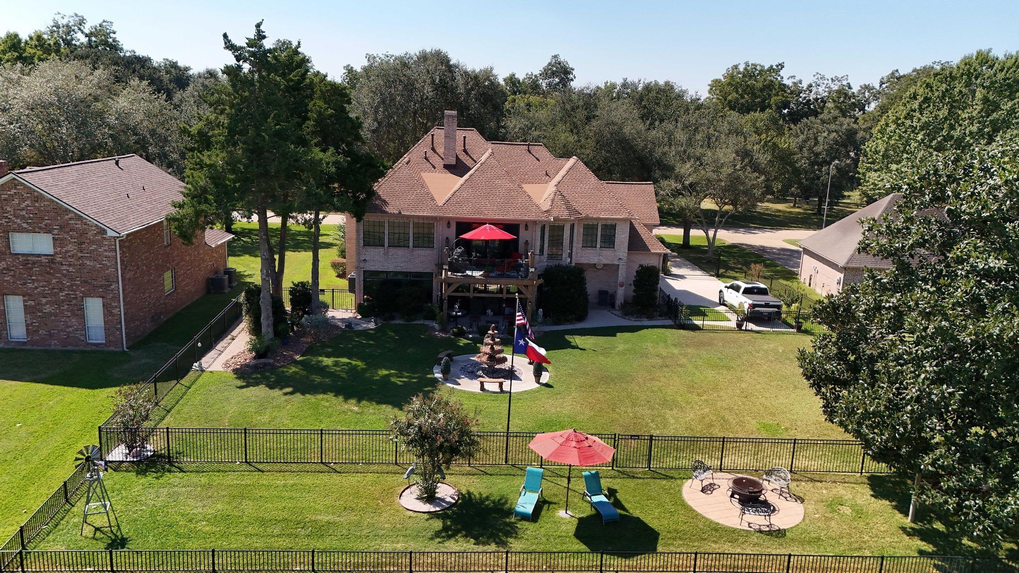 Image 1: Stunning view of the home&rsquo;s full rear elevation, u