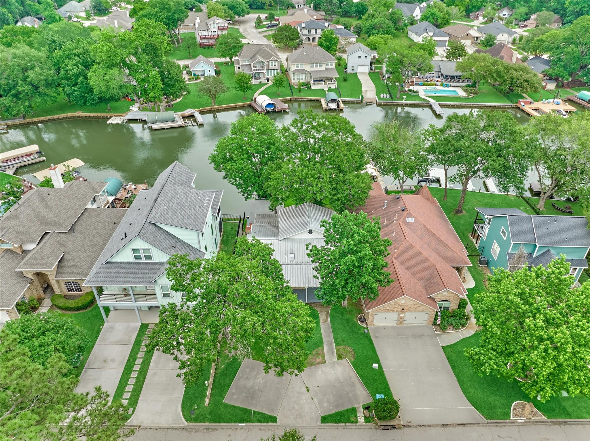 Image 3: Aerial view of the home shows the shaded trees on