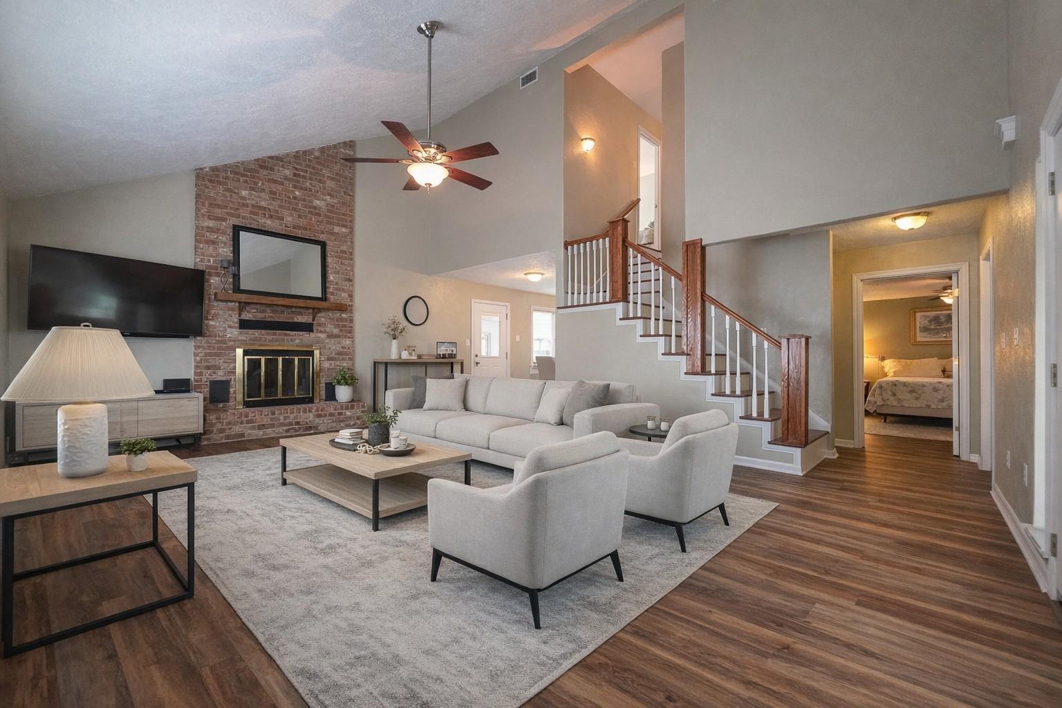 Image 2: Spacious living room with vaulted ceilings, featur
