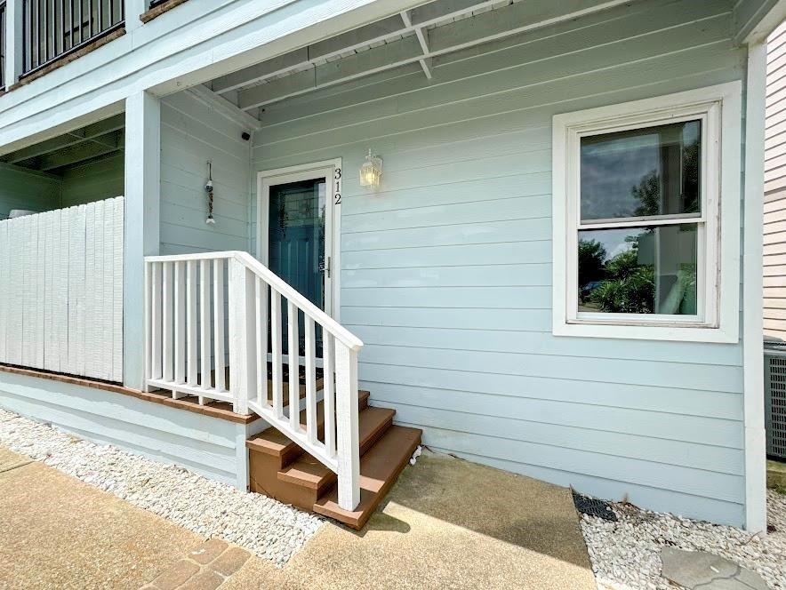 Image 3: This photo shows a charming entryway with light bl