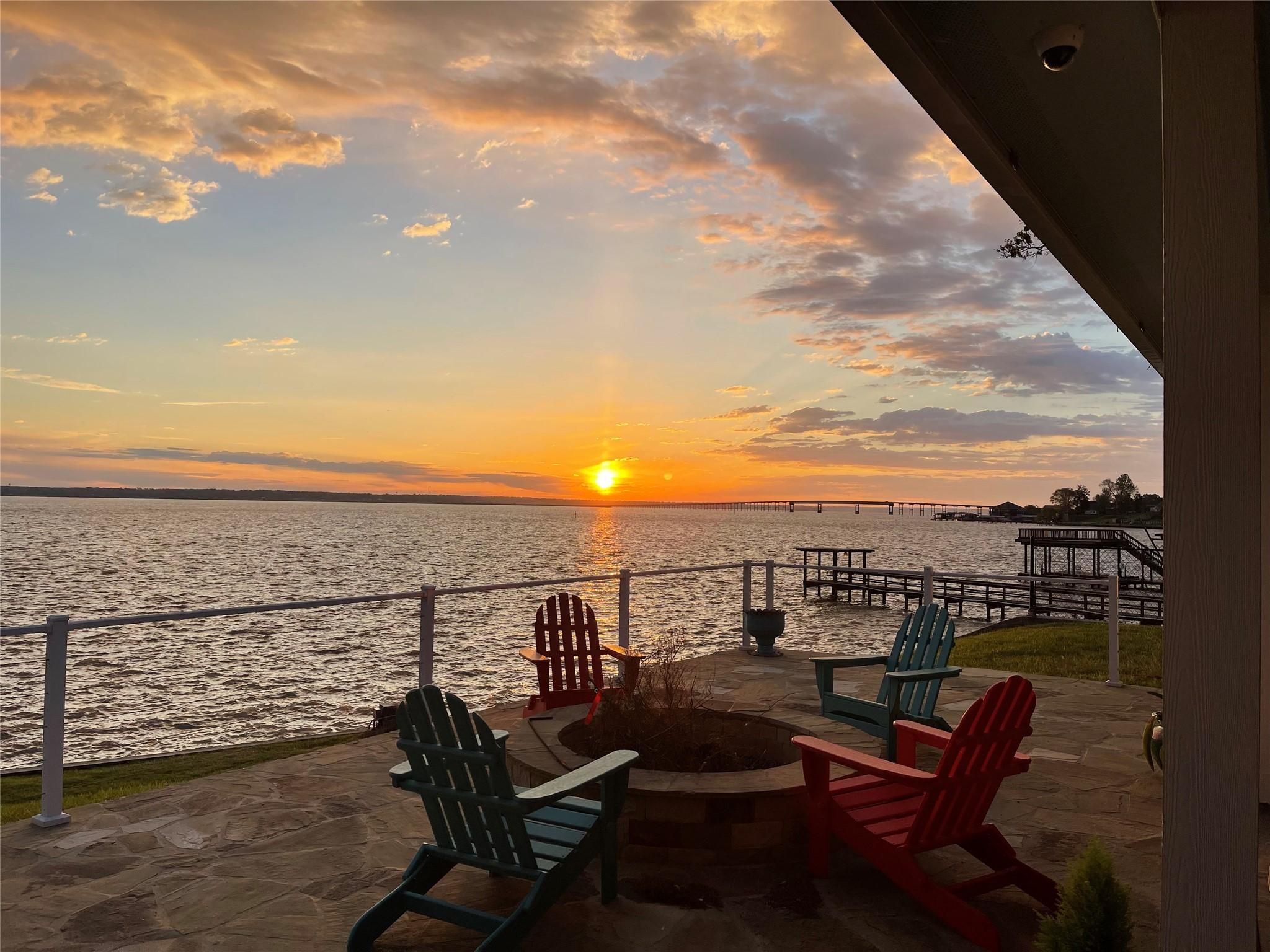 Image 1: Breathtaking sunset views from the waterfront deck