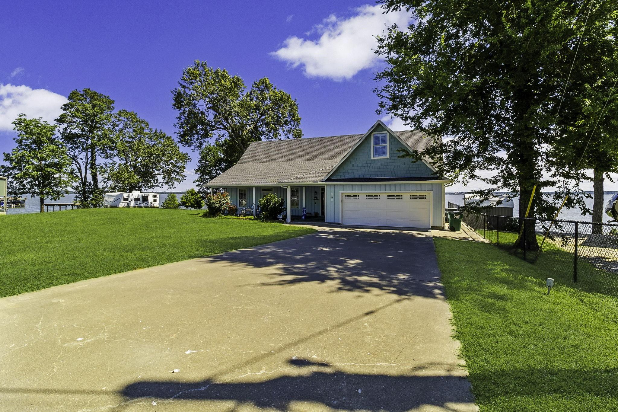 Image 3: Beautiful lakefront property featuring a spacious