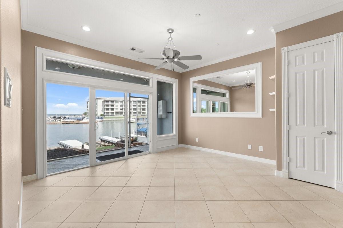 Image 2: Bright, open room with large windows and sliding d