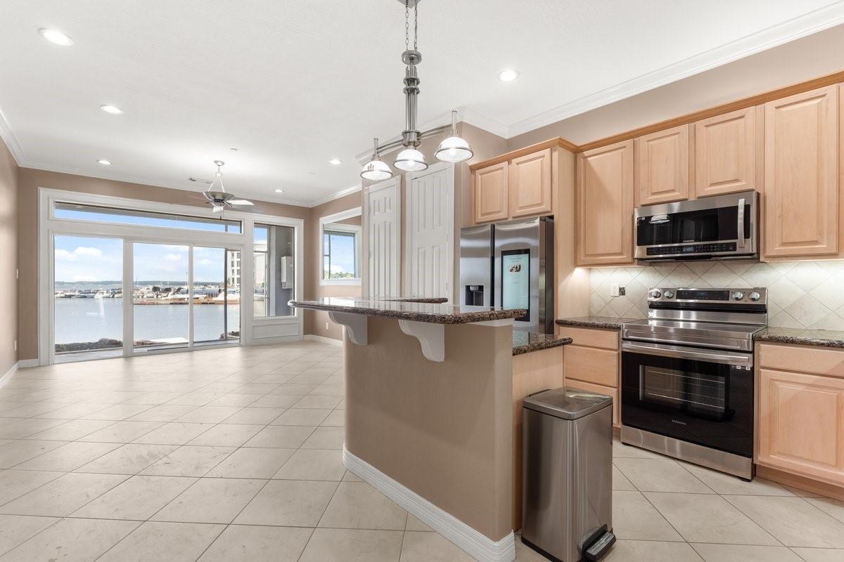 Image 3: Bright and spacious kitchen with modern stainless