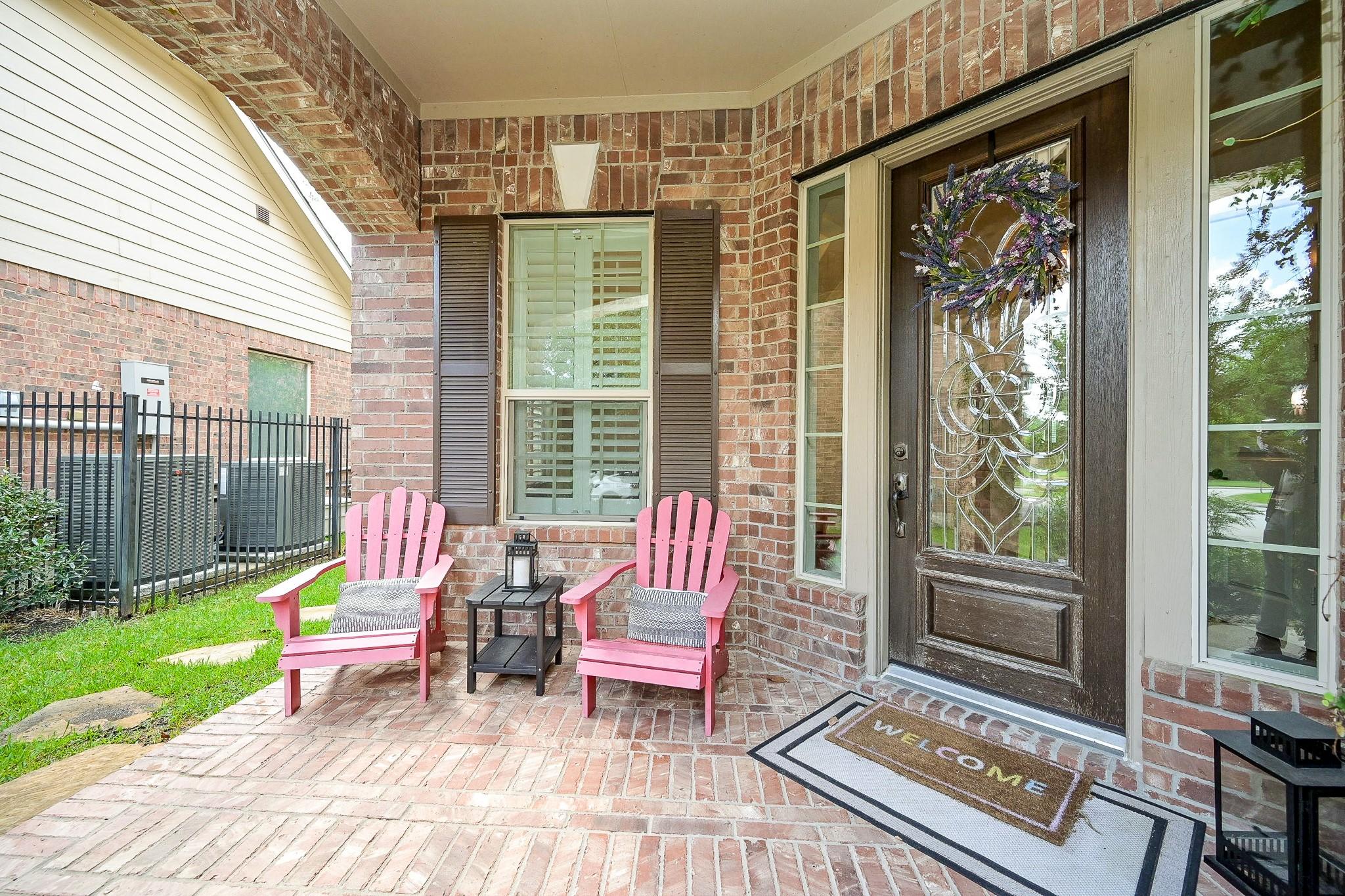 Image 4: Cozy covered front porch, perfect for relaxing mor