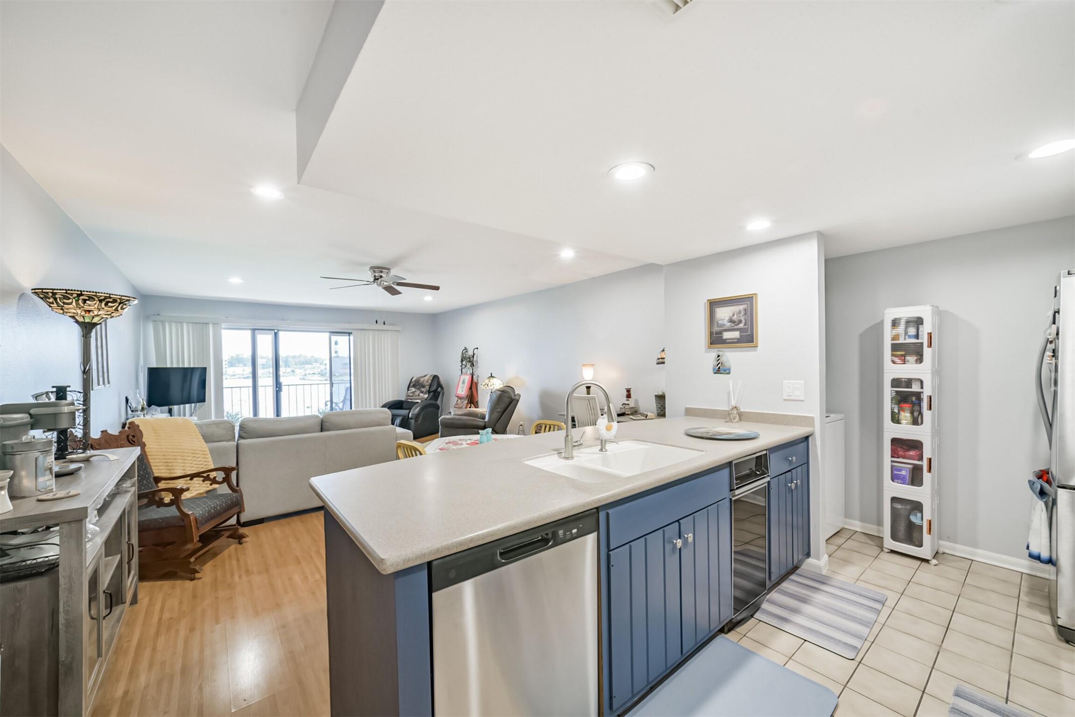 Image 4: This open kitchen with a new dishwasher has lots o