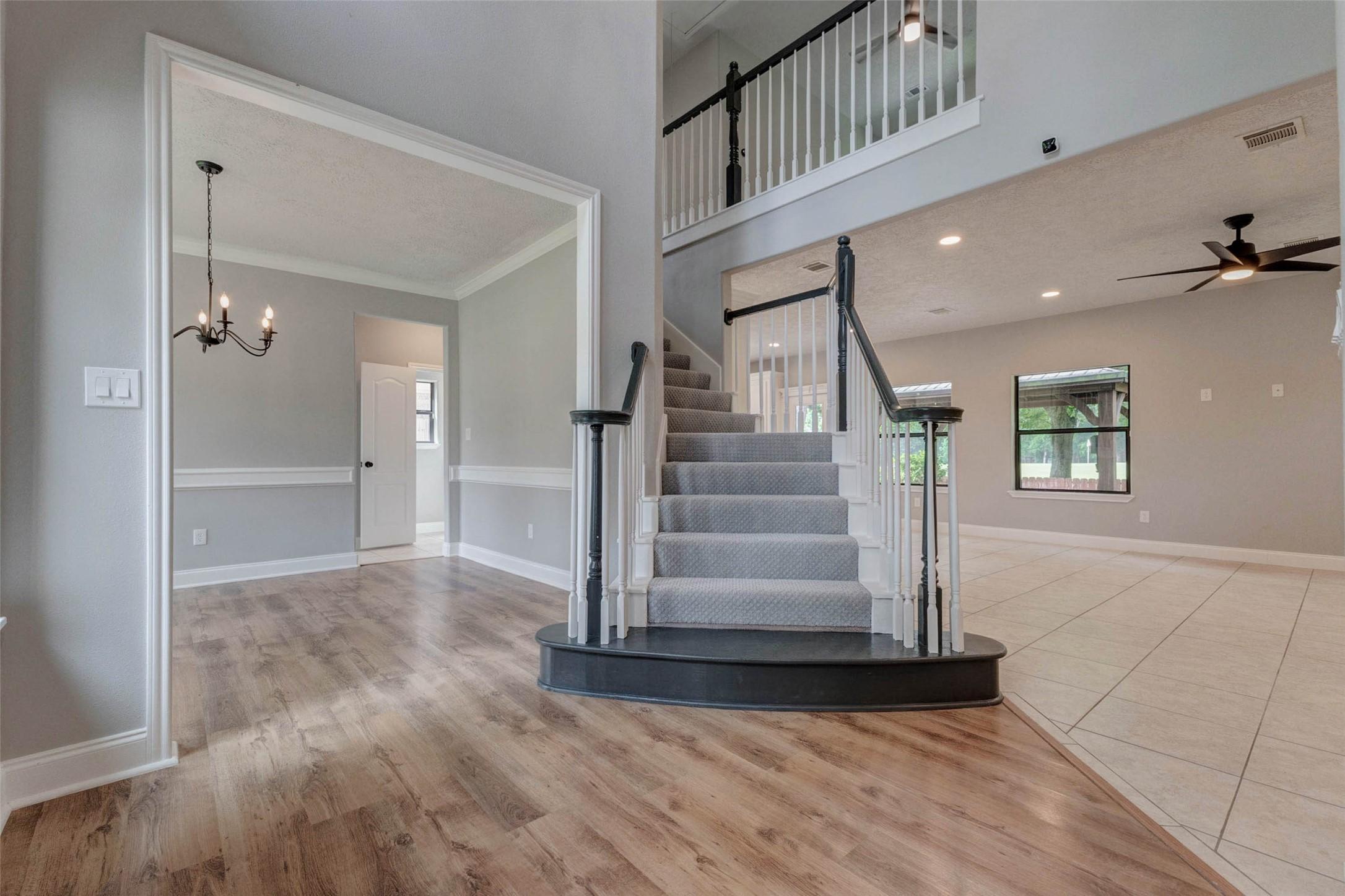 Image 3: Step inside to a welcoming entry featuring a sweep