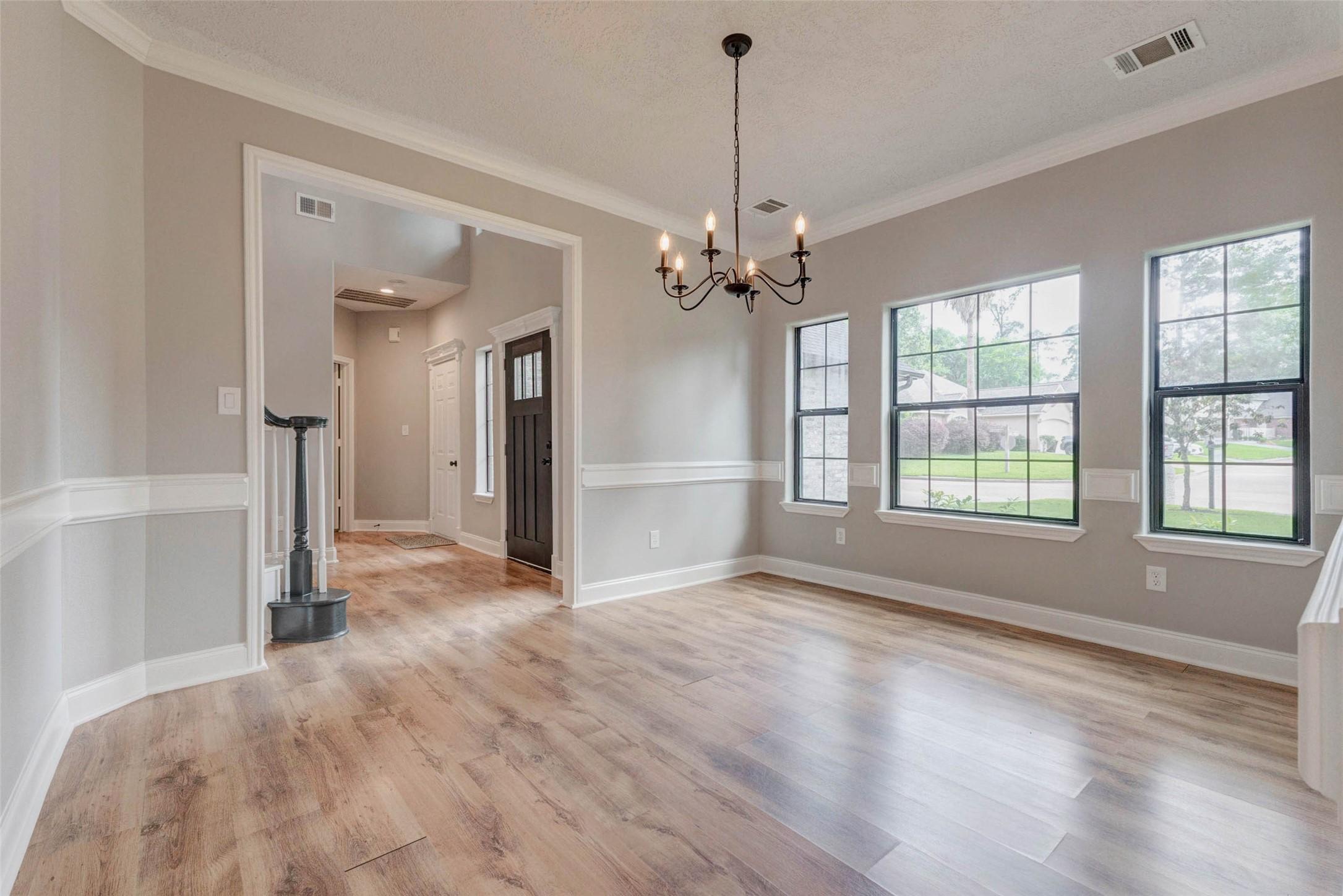 Image 4: The spacious dining area offers ample room for a f
