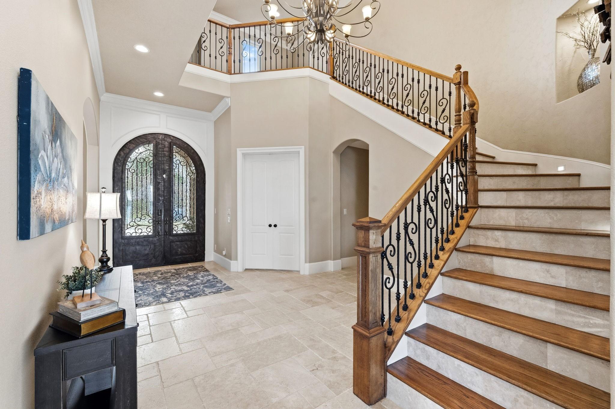 Image 4: An impressive foyer welcomes you with a sweeping s