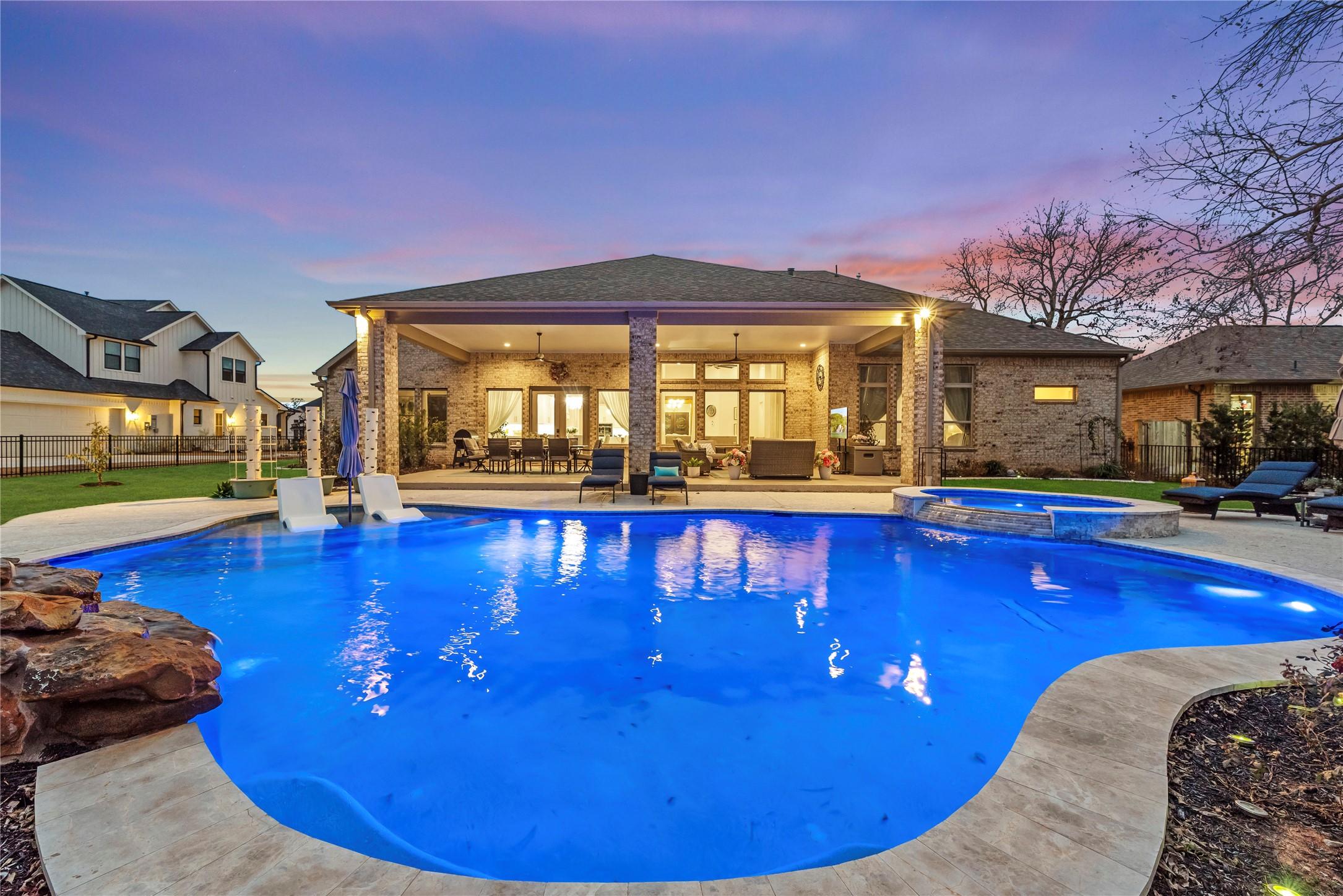 Image 1: Experience a backyard paradise with a spacious poo