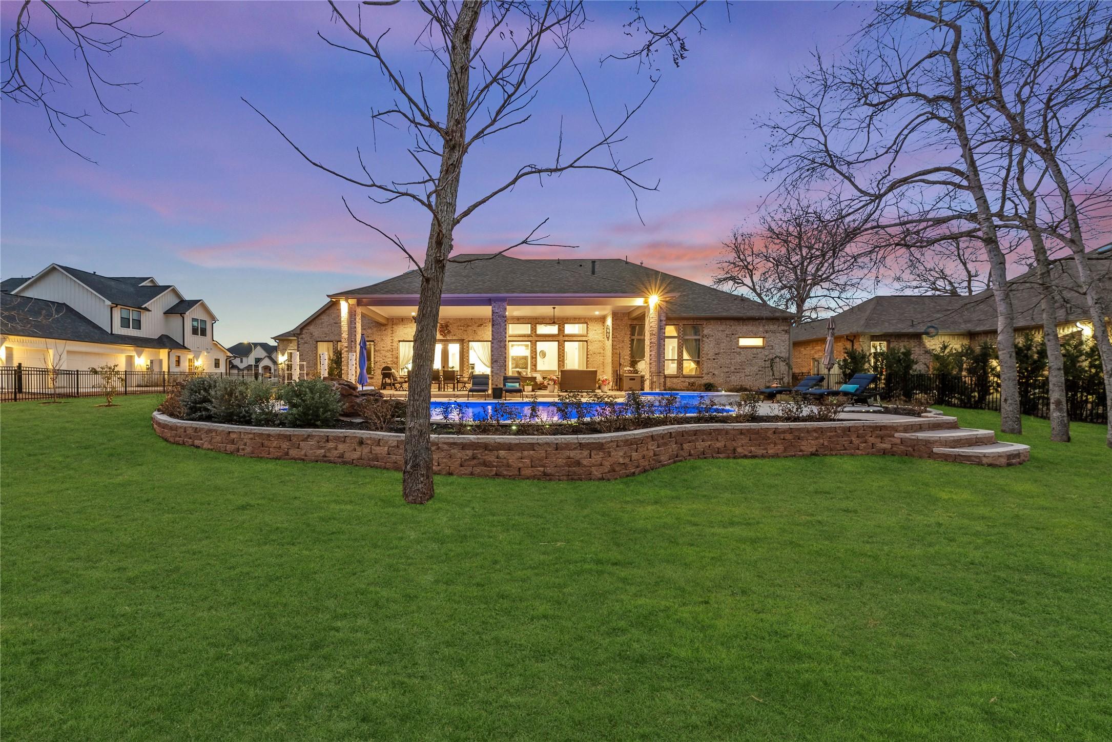 Image 3: This photo showcases a spacious backyard featuring