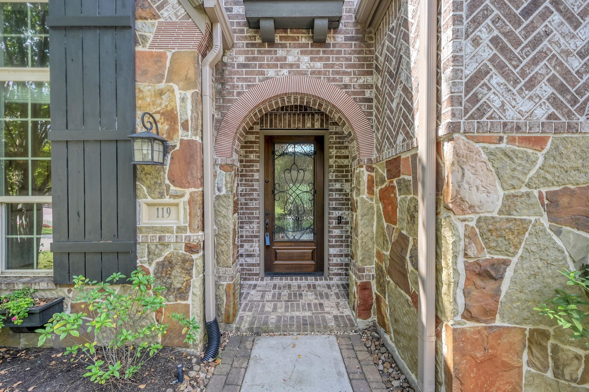 Image 2: Beautiful entry with stone and brick accents