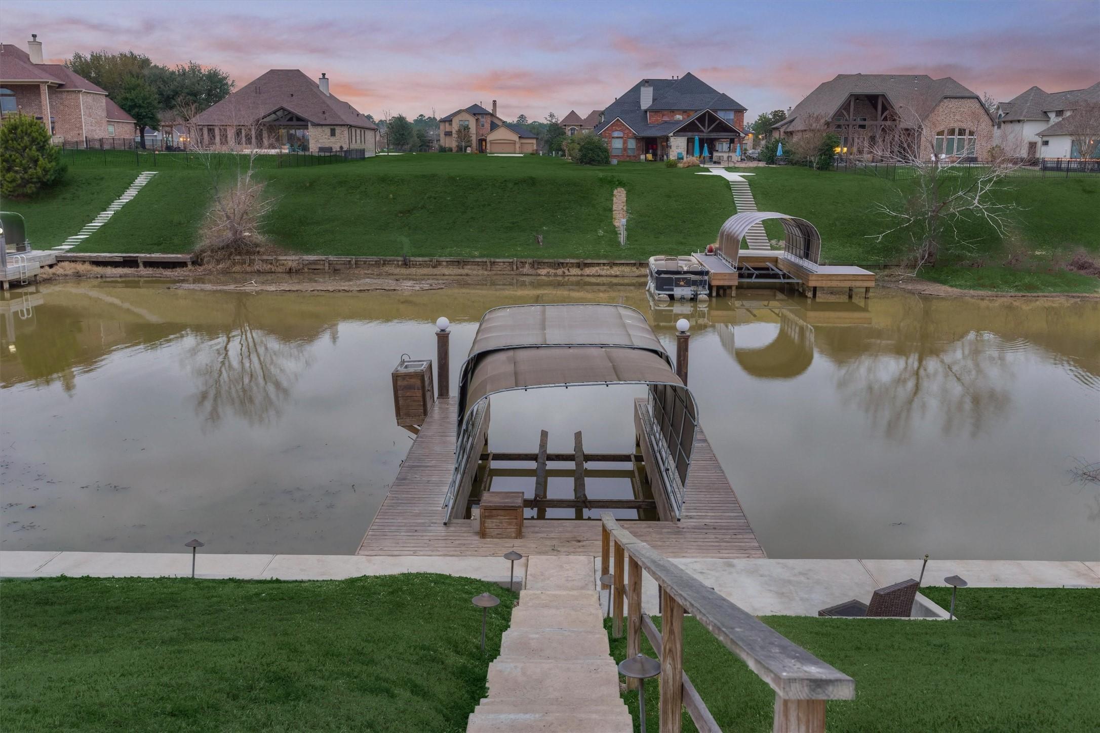 Image 3: A concrete sidewalk and stairs lead to the boat do