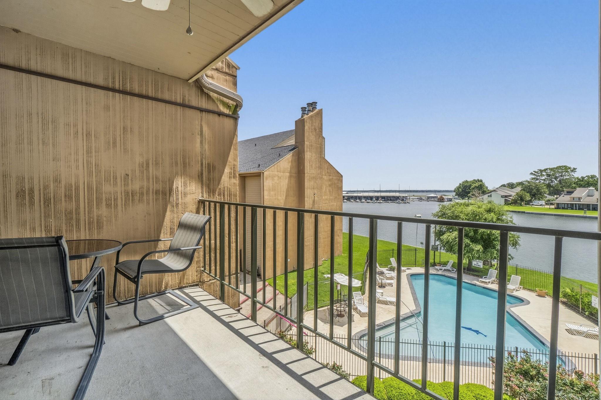 Image 3: Relax and unwind on the covered balcony while enjo