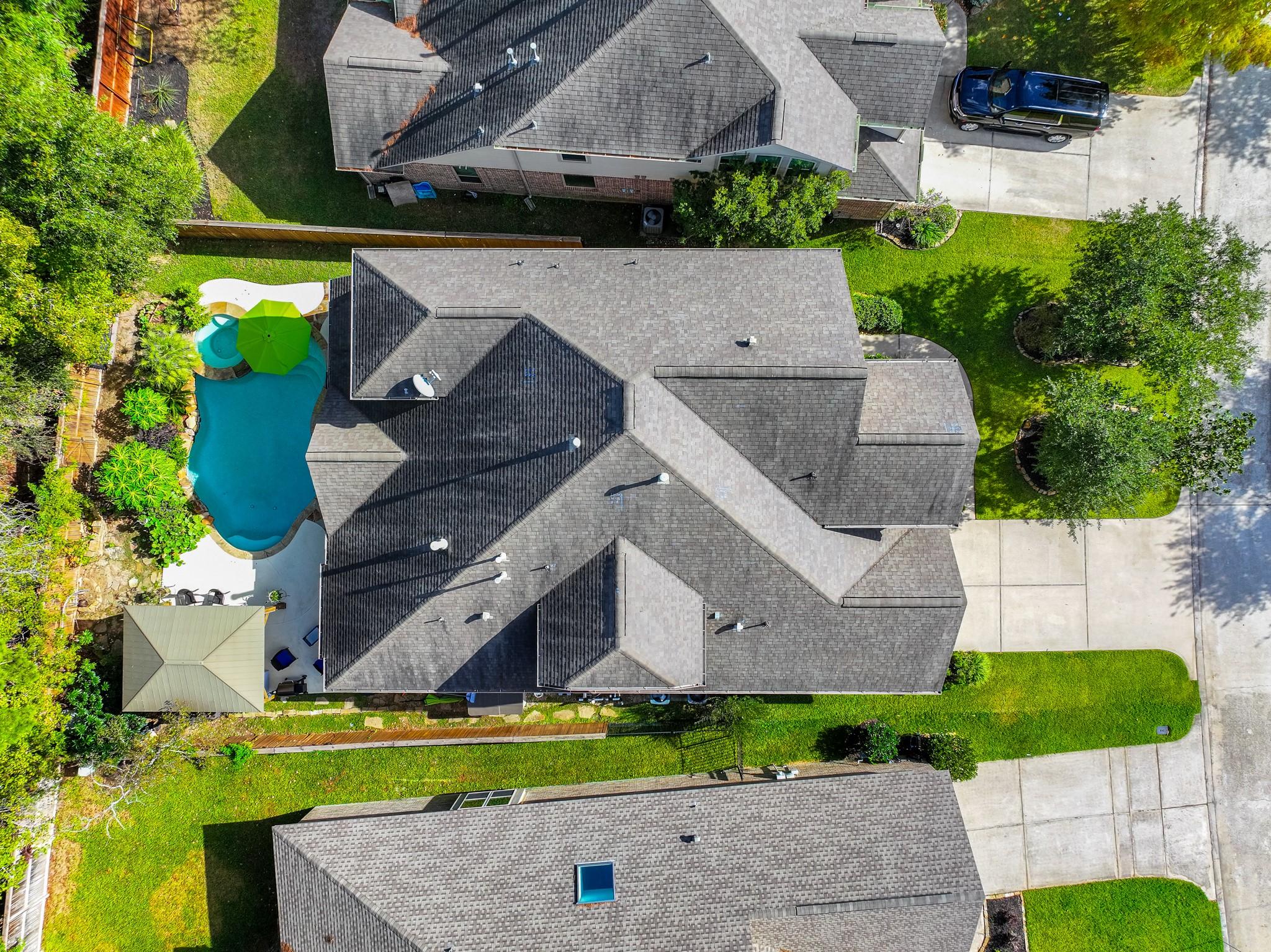 Image 4: This aerial view showcases a residential property