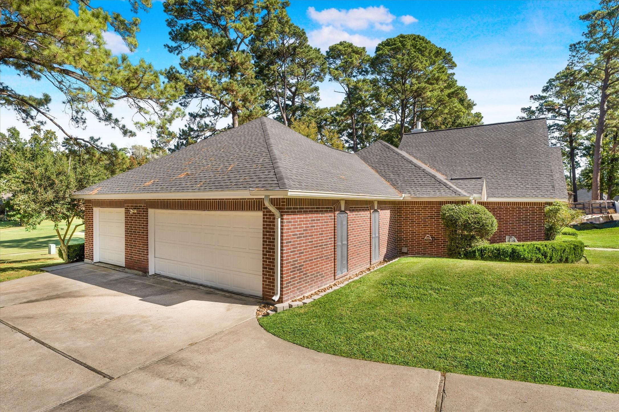 Image 4: Three-car garage provides plenty of space for vehi