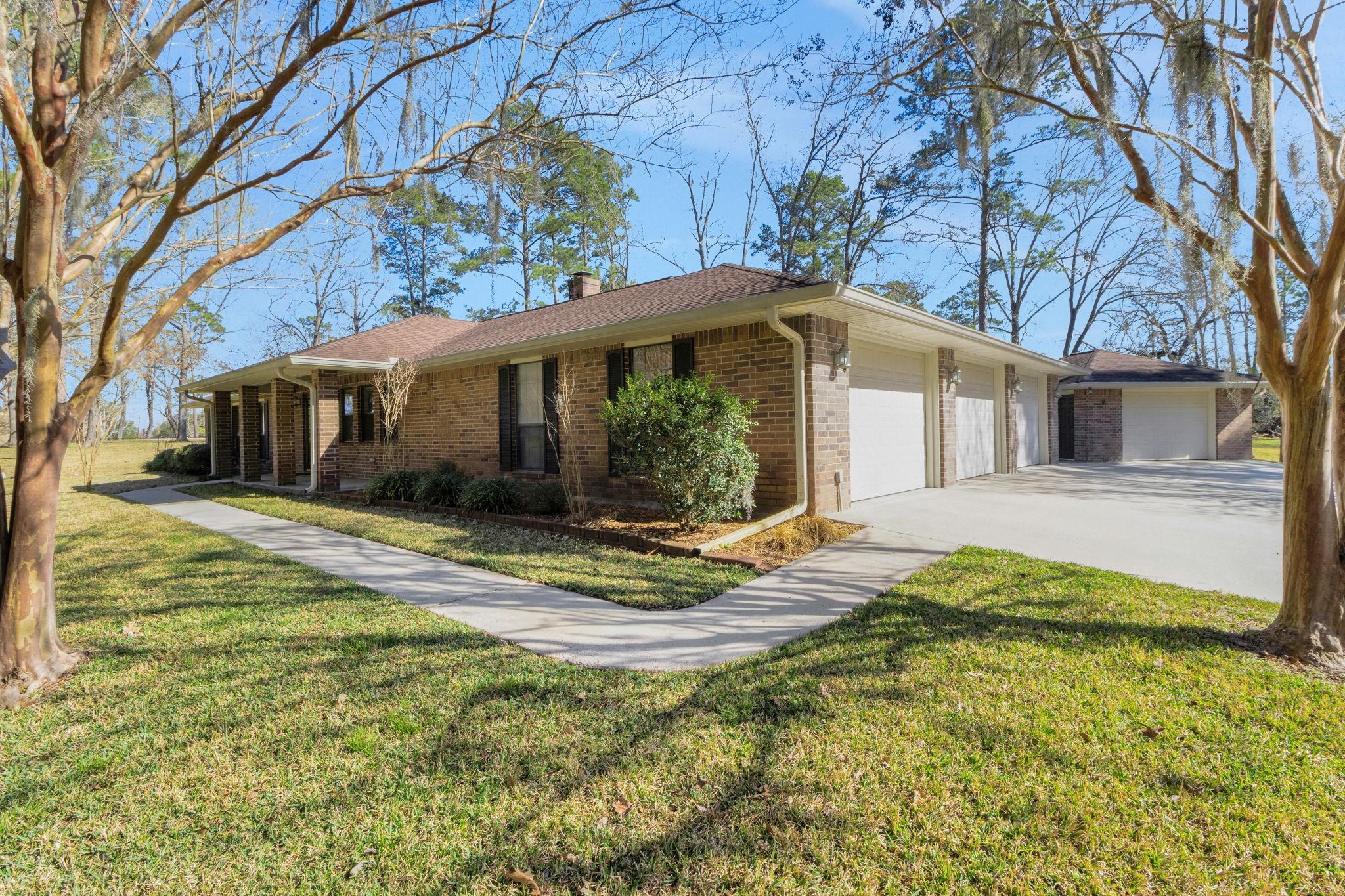 Image 2: This one story brick home is located in the small