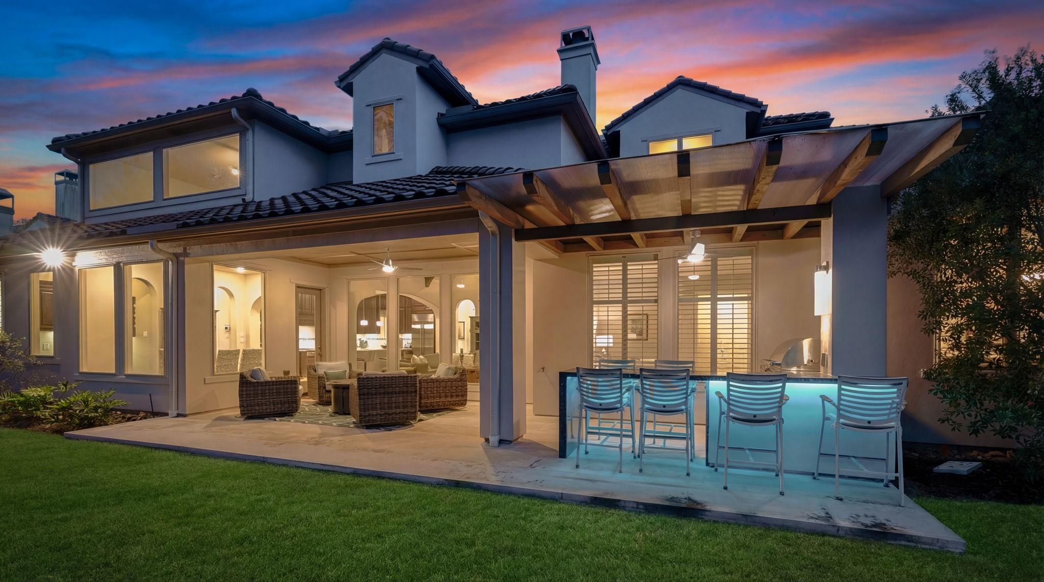 Image 3: Outdoor kitchen area with plenty of seating, and u