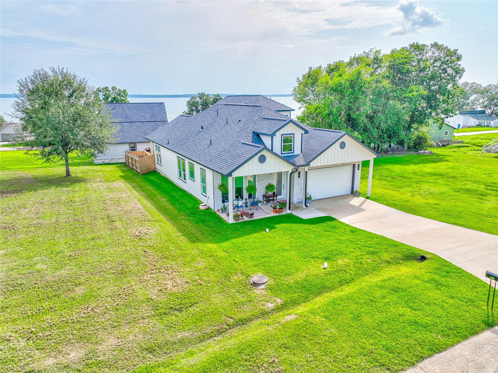 Image 2: The Home features both the lot the home is on as w