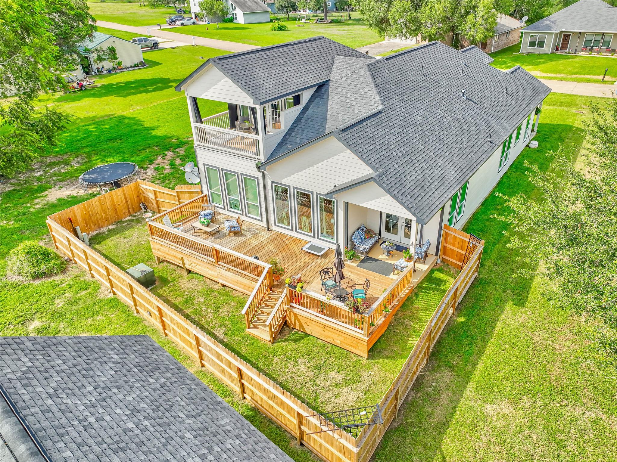 Image 3: Great drone view of the back of the home