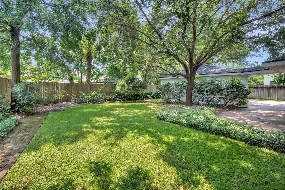 Image 3: Private backyard with brick paver walk way around