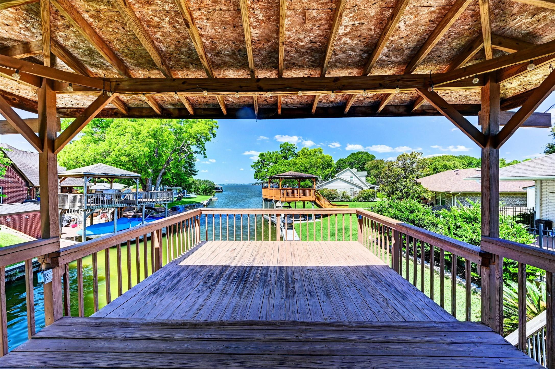 Image 4: Imagine the sunsets over the lake from this deck.