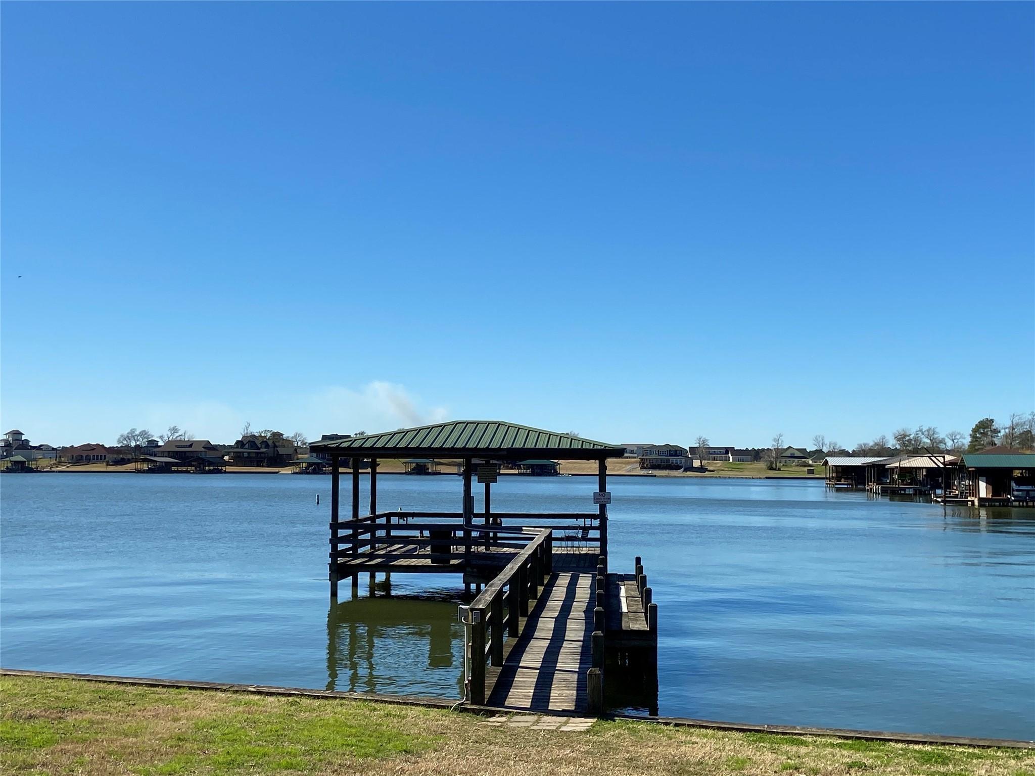 Image 1: A community fishing pier & boat ramp is a short wa