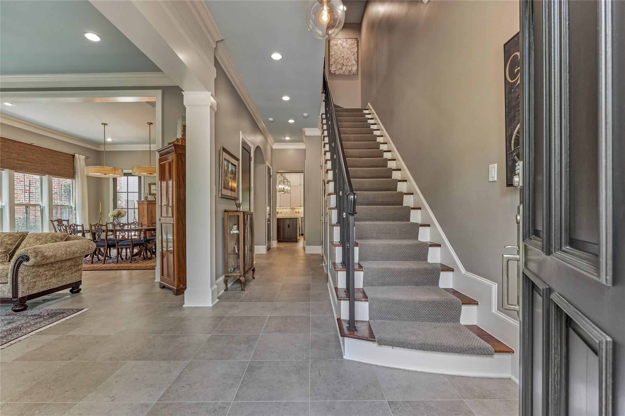Image 4: Open your front door to a grand entry with soaring